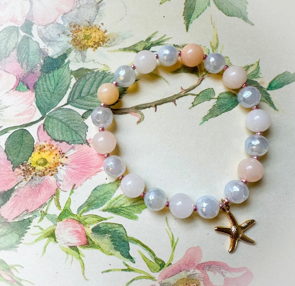 Bracelet with starfish charm on floral background